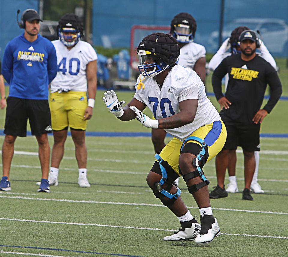 Offensive Lineman Anwar O'neal simulates blocking a defender during the first day of practice for the University of Delaware football team on Tuesday July 30, 2024.