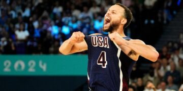 Aug 10, 2024; Paris, France; United States shooting guard Stephen Curry (4) celebrates in the second half against France in the men's basketball gold medal game during the Paris 2024 Olympic Summer Games at Accor Arena. Mandatory Credit: Rob Schumacher-USA TODAY Sports ORG XMIT: OLY-890027 ORIG FILE ID: 20240810_lbm_usa_222.JPG