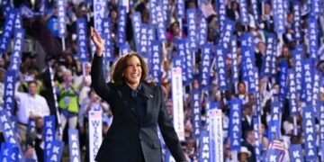 Vice President and 2024 Democratic presidential candidate Kamala Harris waves as she arrives to speak on the fourth and last day of the Democratic National Convention (DNC) at the United Center in Chicago, Illinois, on August 22, 2024.