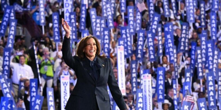 Vice President and 2024 Democratic presidential candidate Kamala Harris waves as she arrives to speak on the fourth and last day of the Democratic National Convention (DNC) at the United Center in Chicago, Illinois, on August 22, 2024.