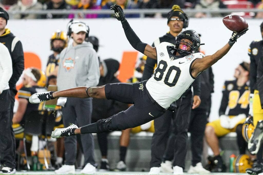 Wake Forest Demon Deacons wide receiver Jahmal Banks (80)(80) leaps for a pass against the Missouri Tigers in the second quarter in the 2022 Gasparilla Bowl at Raymond James Stadium.