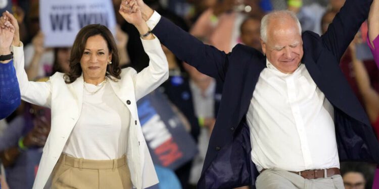 Democratic presidential nominee Vice President Kamala Harris and running mate Minnesota Gov. Tim Walz at a campaign rally on Aug. 7, in Romulus, Michigan. (Carlos Osorio/AP)