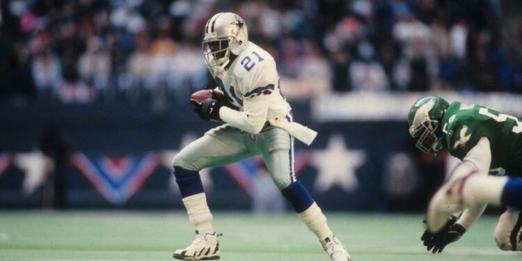 Defensive back Deion Sanders #21 of the Dallas Cowboys returns a punt for a touchdown against the Philadelphia Eagles at Texas Stadium in the 1995 NFC Divisional Playoff Game on January 7, 1996 in Irving, Texas. (Credit: Getty)