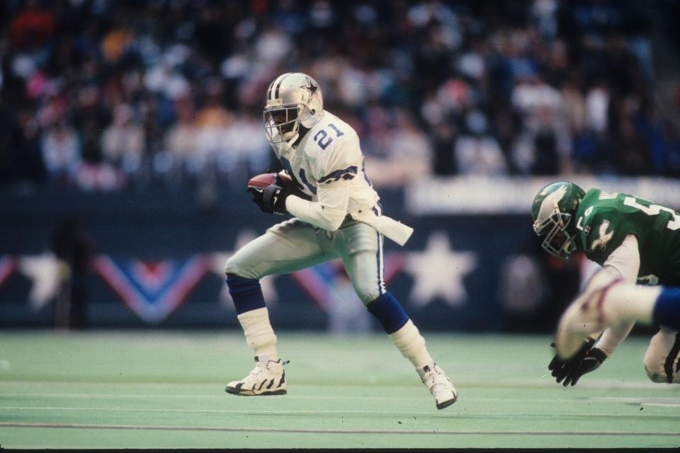 Defensive back Deion Sanders #21 of the Dallas Cowboys returns a punt for a touchdown against the Philadelphia Eagles at Texas Stadium in the 1995 NFC Divisional Playoff Game on January 7, 1996 in Irving, Texas. (Credit: Getty)