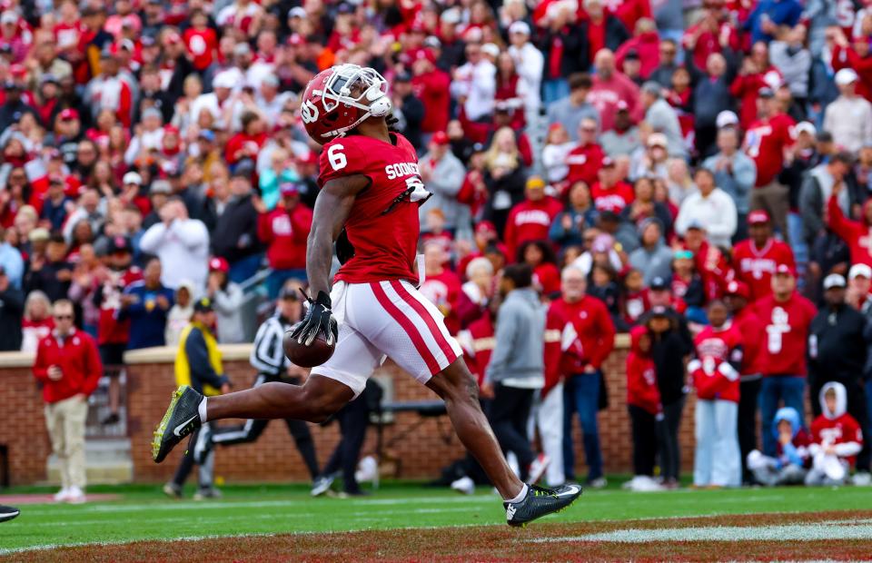 Apr 20, 2024; Norman, OK, USA; Oklahoma Sooners wide receiver Deion Burks (6) celebrates after catching a touchdown pass during the Oklahoma Sooners spring game at Gaylord Family OK Memorial Stadium. Mandatory Credit: Kevin Jairaj-USA TODAY Sports