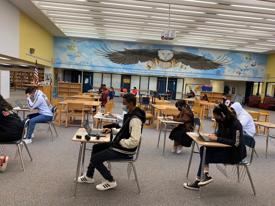 East Mecklenburg High students take exams in the school library in February 2022.