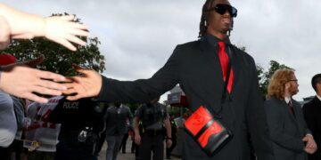 Sep 9, 2023; Columbus, Ohio, USA; Ohio State Buckeyes wide receiver Marvin Harrison Jr. (18) greets fans before the game against the Youngstown State Penguins at Ohio Stadium. Mandatory Credit: Joseph Maiorana-USA TODAY Sports