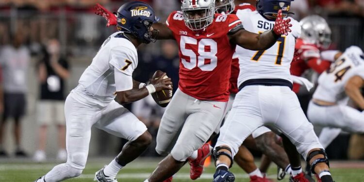 Sep 17, 2022; Columbus, Ohio, USA; Ohio State Buckeyes defensive tackle Ty Hamilton (58) pursues Toledo Rockets quarterback Dequan Finn (7) during the first half of the NCAA Division I football game at Ohio Stadium. Mandatory Credit: Adam Cairns-The Columbus Dispatch