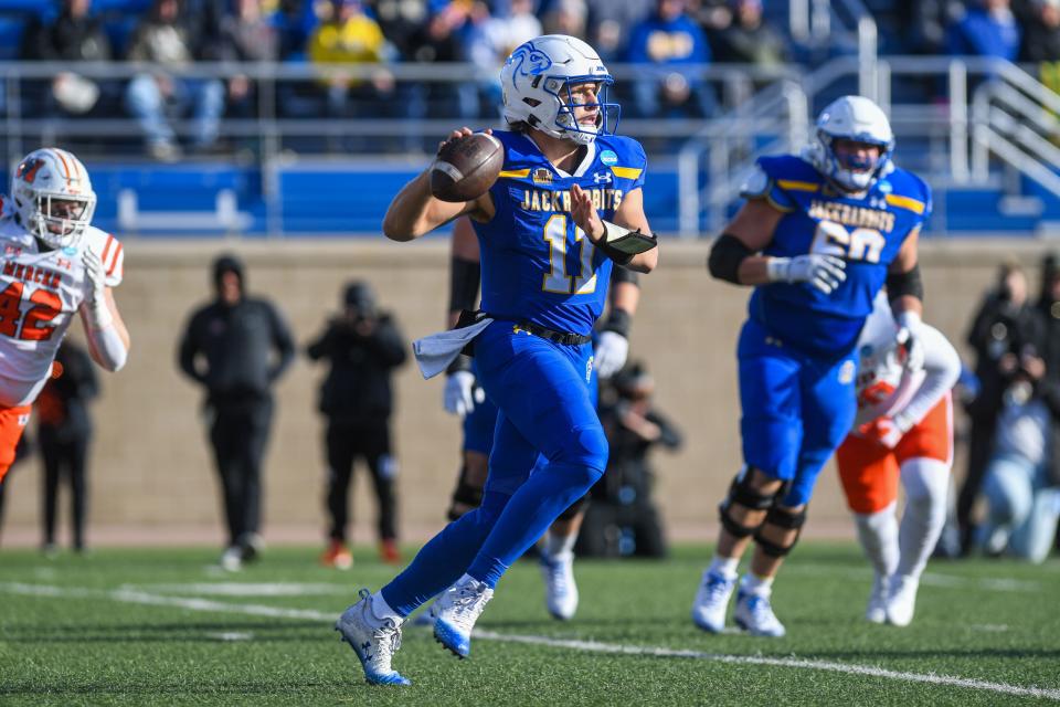 SDSU's quarterback Mark Gronowski (11) runs with the ball during a game against Mercer University on Saturday, Dec. 2, 2023, at Dana J Dykhouse Stadium in Brookings.