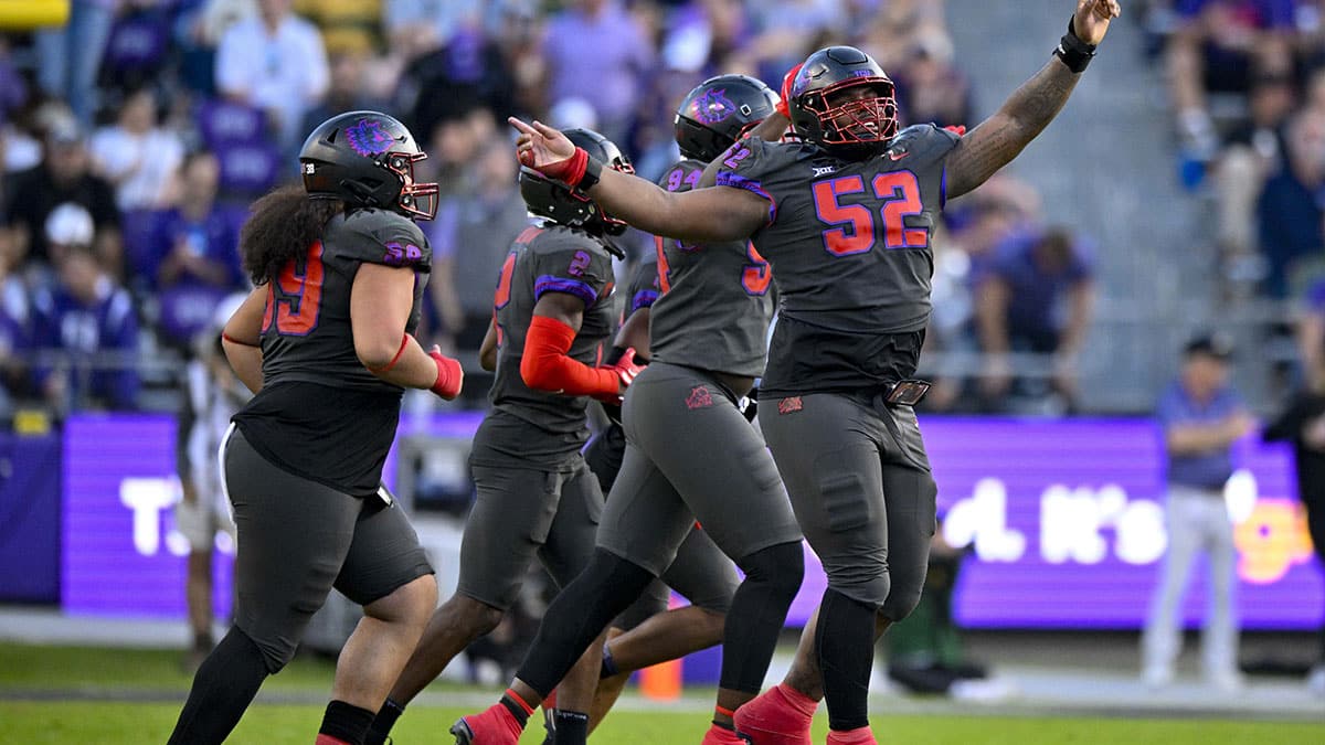 TCU Horned Frogs defensive lineman Damonic Williams (52) and the Frogs defense celebrate after making a defensive stop against the Baylor Bears during the second half at Amon G. Carter Stadium.