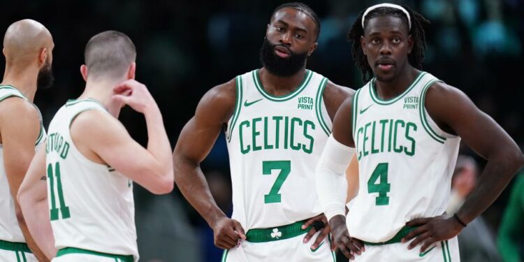 Feb 1, 2024; Boston, Massachusetts, USA; Boston Celtics guard Jrue Holiday (4), guard Jaylen Brown (7), guard Payton Pritchard (11) and guard Derrick White (9) on the court against the Los Angeles Lakers in the second half at TD Garden. Mandatory Credit: David Butler II-USA TODAY Sports