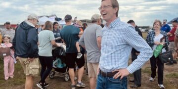 U.S. Rep. Dusty Johnson, R-South Dakota, greets attendees at the Sioux Empire Fair in Sioux Falls on Aug. 7, 2024. (Joshua Haiar/South Dakota Searchlight)