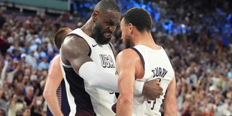 LeBron James (6) and shooting guard Stephen Curry (4) celebrate