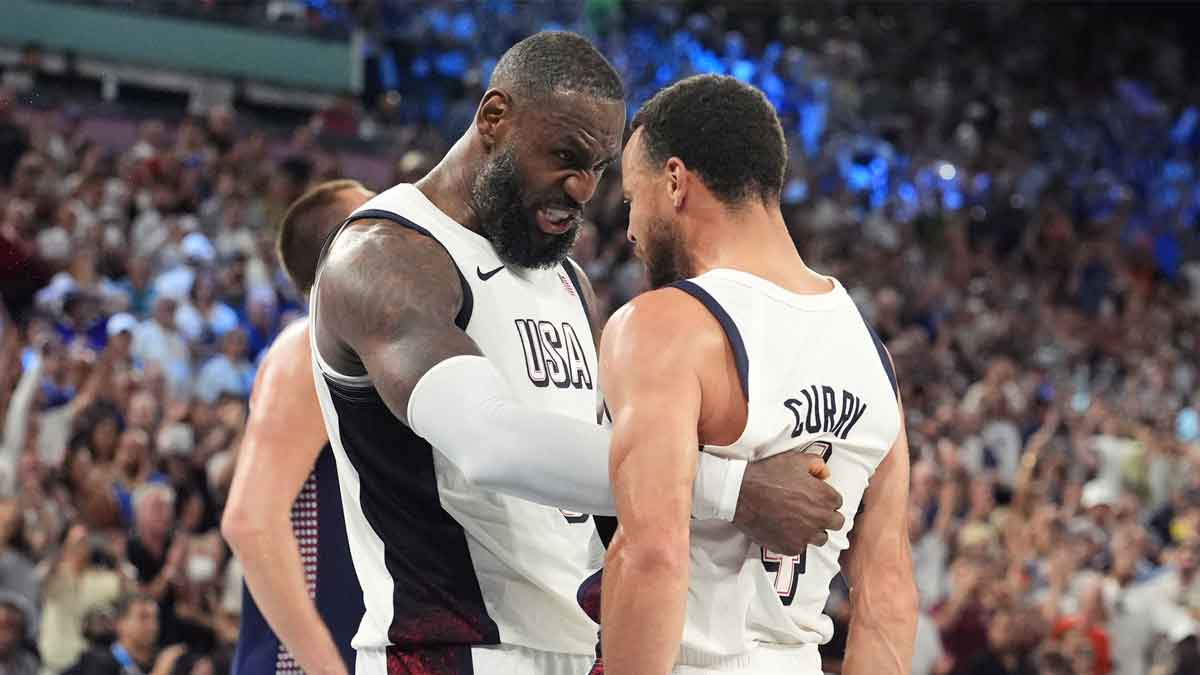 LeBron James (6) and shooting guard Stephen Curry (4) celebrate