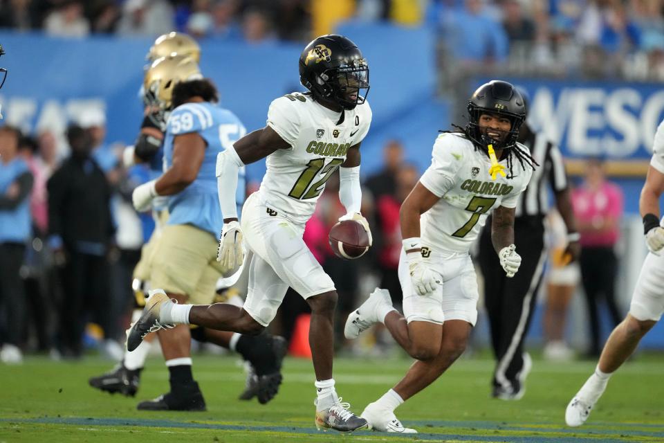 Oct 28, 2023; Pasadena, California, USA; Colorado Buffaloes cornerback Travis Hunter (12) celebrates after intercepting a pass against the UCLA Bruins in the first half at Rose Bowl. Mandatory Credit: Kirby Lee-USA TODAY Sports