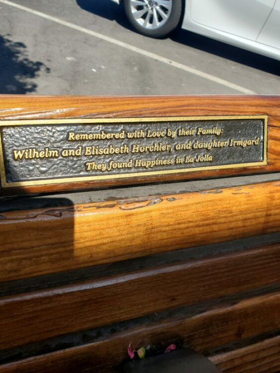 A plaque honoring members of the Horchler family is displayed on a memorial bench that was recently sanded and re-stained. (Ashley Mackin-Solomon)