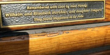 A plaque honoring members of the Horchler family is displayed on a memorial bench that was recently sanded and re-stained. (Ashley Mackin-Solomon)