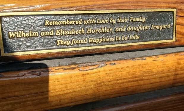 A plaque honoring members of the Horchler family is displayed on a memorial bench that was recently sanded and re-stained. (Ashley Mackin-Solomon)