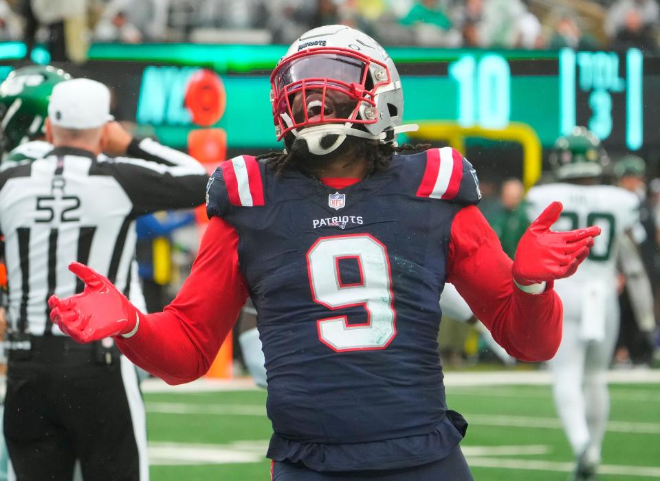 Sep 24, 2023; East Rutherford, New Jersey, USA; New York Jets quarterback Zach Wilson (2) is sacked for a safety by New England Patriots linebacker Matthew Judon (9) in the 4th quarter at MetLife Stadium. Mandatory Credit: Robert Deutsch-USA TODAY Sports