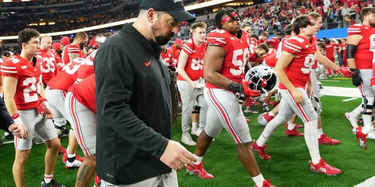 Ohio State Buckeyes head coach Ryan Day walks off the field following their 14-3 loss to the Missouri Tigers in the Goodyear Cotton Bowl Classic at AT&T Stadium.