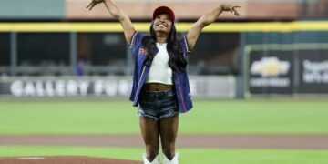 Simone Biles, Paris Summer Olympics 2024 gymnast gold medal winner, reacts after throwing out the ceremonial first pitch. Olympian teammate and gold medalist , Jordan Chiles, and the Houston area Olympians were also in attendance before the Kansas City Royals played against the Houston Astros at Minute Maid Park.