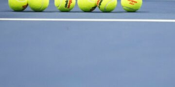 Sep 8, 2022; Flushing, NY, USA; A set of new balls rests on the court during a changeover in the match between Aryna Sabalenka and Iga Swiatek (POL) (both not pictured) on day eleven of the 2022 U.S. Open tennis tournament at USTA Billie Jean King Tennis Center. Mandatory Credit: Danielle Parhizkaran-USA TODAY Sports