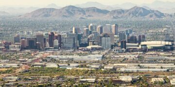 Pictured: An aerial view of the skyline in downtown Phoenix, Arizona, where the cost of a one-bedroom rental unit has jumped 84 percent over the last five years