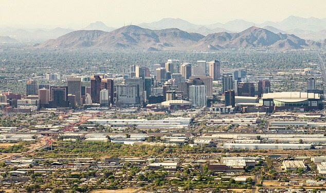 Pictured: An aerial view of the skyline in downtown Phoenix, Arizona, where the cost of a one-bedroom rental unit has jumped 84 percent over the last five years