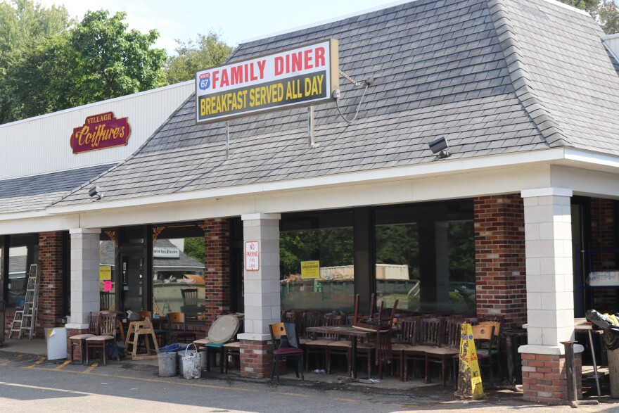 Furniture sits outside the 67 Family Diner. Officials said the water was as high as the roof on Sunday.