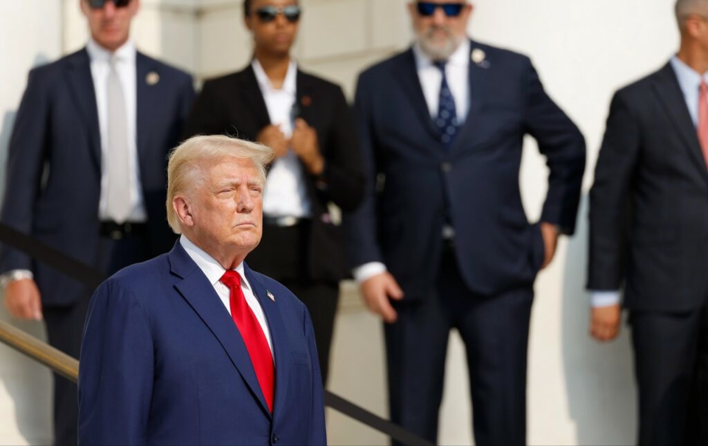 Donald Trump looks on during a wreath laying ceremony at the Tomb of the Unknown Soldier at Arlington National Cemetery on August 26, 2024 in Arlington, Virginia.