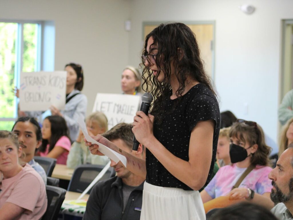 Maëlle Jacques, 16, a junior student-athlete at Kearsarge Regional High School who is transgender, speaks to her local school board in New London, N.H., on Thursday, Aug. 29, 2024, about her desire to continue playing girls' sports.