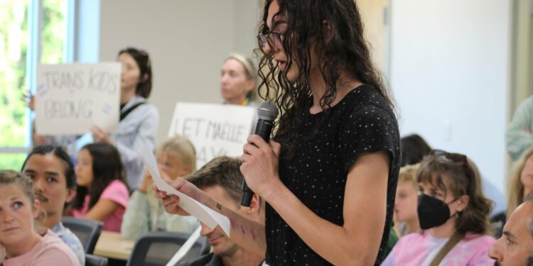 Maëlle Jacques, 16, a junior student-athlete at Kearsarge Regional High School who is transgender, speaks to her local school board in New London, N.H., on Thursday, Aug. 29, 2024, about her desire to continue playing girls' sports.