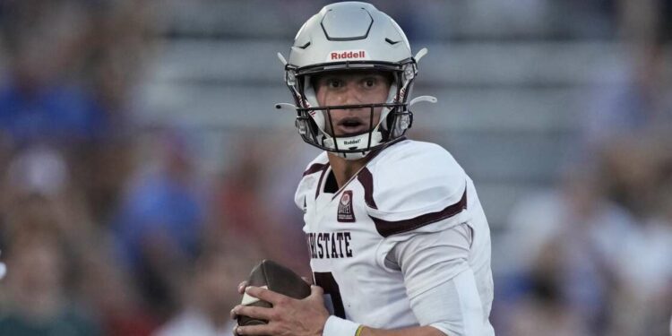 Missouri State quarterback Jacob Clark looks to pass during the first half of an NCAA college football game against Kansas Friday, Sept. 1, 2023, in Lawrence, Kan. (AP Photo/Charlie Riedel)