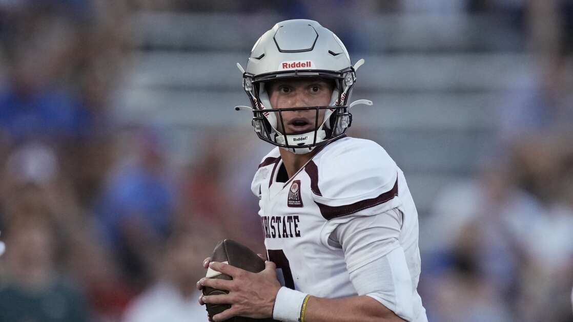 Missouri State quarterback Jacob Clark looks to pass during the first half of an NCAA college football game against Kansas Friday, Sept. 1, 2023, in Lawrence, Kan. (AP Photo/Charlie Riedel)