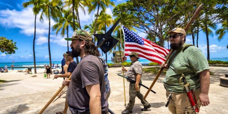 Members of the Hawaii Firearms Coalition with their weapons in Waikiki.