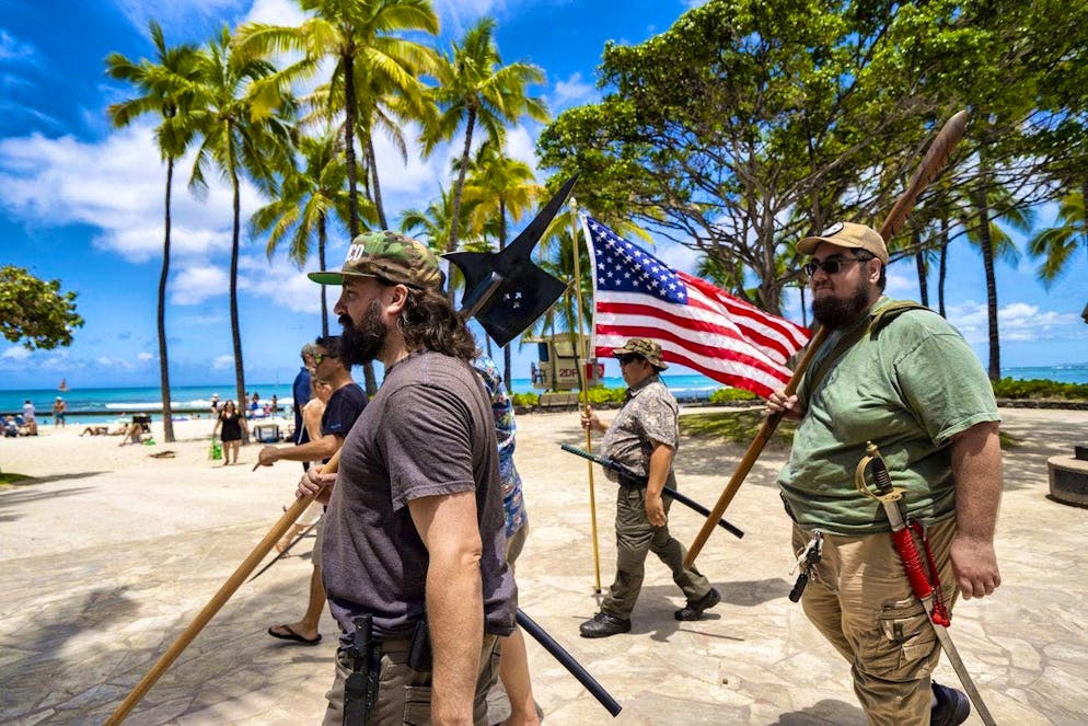 Members of the Hawaii Firearms Coalition with their weapons in Waikiki.