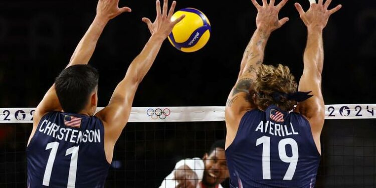 REUTERS/SIPHIWE SIBEKOWilfredo Leon Venero of Poland in action, today, with Micah Christenson and Taylor Averill of United States in the mens volleyball semifinals of the 2024 Paris Olympics.