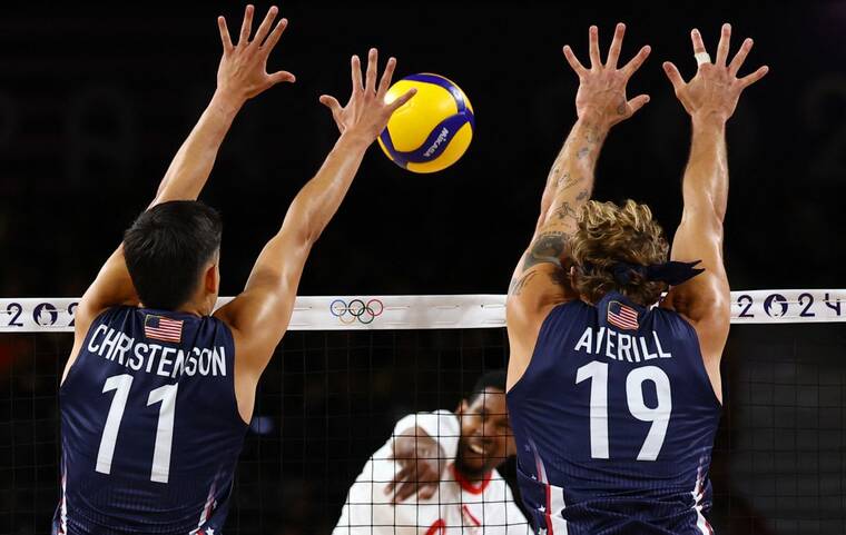 REUTERS/SIPHIWE SIBEKOWilfredo Leon Venero of Poland in action, today, with Micah Christenson and Taylor Averill of United States in the mens volleyball semifinals of the 2024 Paris Olympics.