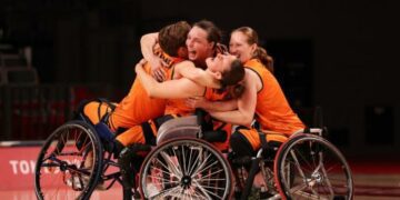 Members of the Dutch wheelchair basketball team celebrate