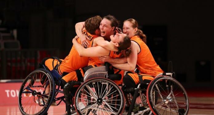 Members of the Dutch wheelchair basketball team celebrate