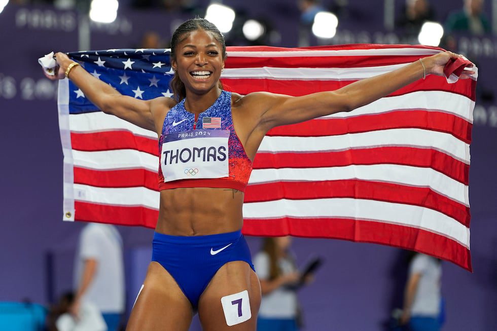 Gabrielle Thomas, of the United States, celebrates after winning the women's 200-meter final...