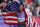 PARIS, FRANCE - AUGUST 10: Masai Russell of Team United States celebrates winning the Gold medal in the Women's 100m Hurdles Final on day fifteen of the Olympic Games Paris 2024 at Stade de France on August 10, 2024 in Paris, France. (Photo by Al Bello/Getty Images)