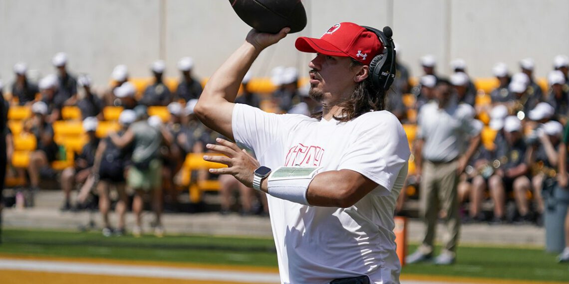 Utah Utes quarterback Cameron Rising (7) plays catch during a timeout in the second half of a game against the Baylor Bears at McLane Stadium.