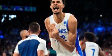 France's Victor Wembanyama celebrates against Germany in a men's basketball semifinal game during the Paris Olympics at Accor Arena.