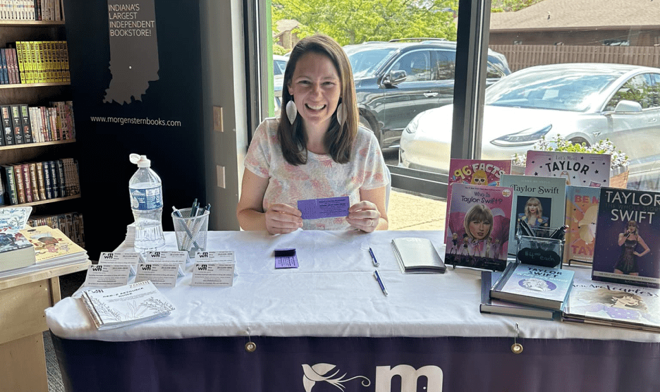 Melissa Colman mans a table at Morgenstern Books on Aug. 18, 2024, to sell raffle tickets for a chance to see Taylor Swift in Indianapolis.