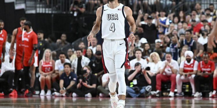 Jul 10, 2024; Las Vegas, Nevada, USA; USA guard Steph Curry (4) celebrates scoring on Canada during the first quarter of the USA Basketball Showcase at T-Mobile Arena.