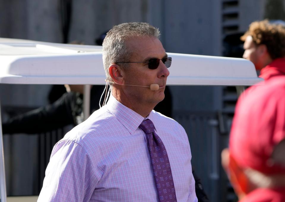 Oct 21, 2023; Columbus, Ohio, USA; Former Ohio State Buckeye football coach Urban Meyer walks to the Big Noon Kickoff show set before the Penn State Nittany Lions game at Ohio Stadium.