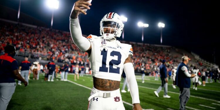 Auburn safety Caleb Wooden (12) exits the field after defeating Vanderbilt at FirstBank Stadium in Nashville, Tenn., Saturday, Nov. 4, 2023.