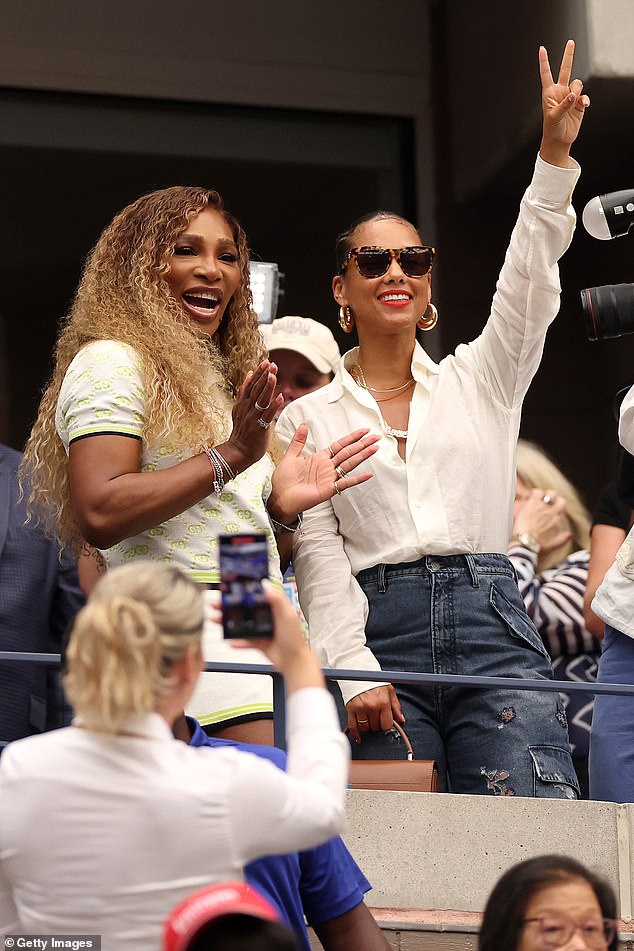 The singer-songwriter donned a pair of ripped cargo-style jeans to enjoy the tournament and accessorised with a pair of chunky gold earrings and several layered necklaces