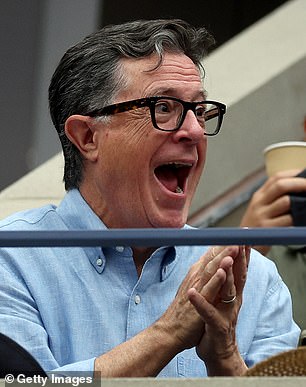 Comedian Stephen Colbert looked animated as he watched the action